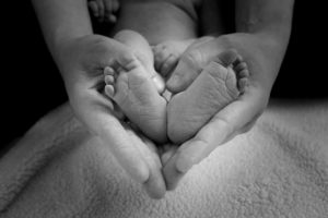 Mom holding baby's feet